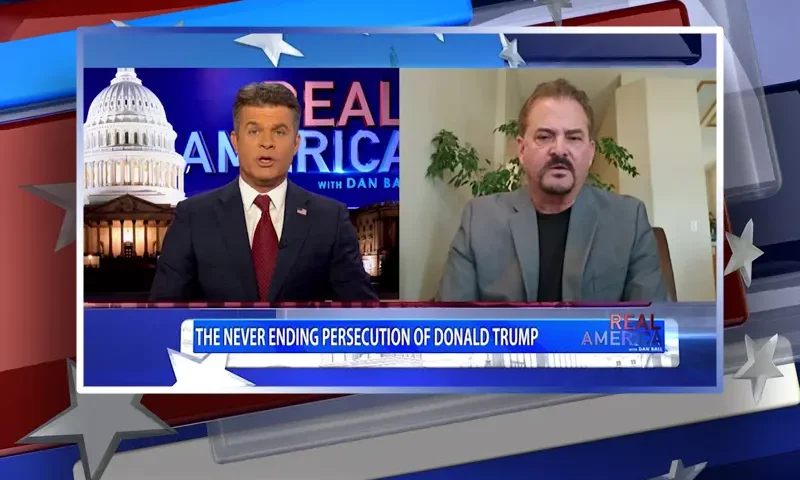 Video still from Real America on One America News Network showing a split screen of the host on the left side, and on the right side is the guest, David Wohl.