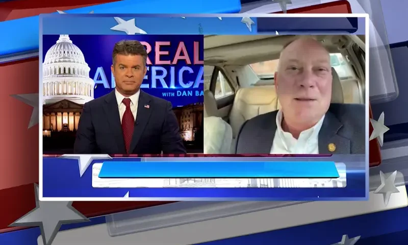 Video still from Real America on One America News Network showing a split screen of the host on the left side, and on the right side is the guest, Matt Maddock.