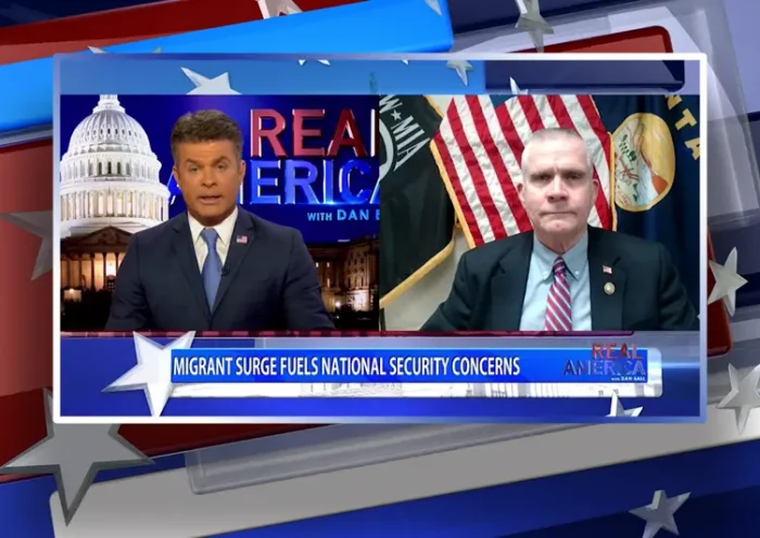 Video still from Real America on One America News Network showing a split screen of the host on the left side, and on the right side is the guest, Rep. Matt Rosendale.
