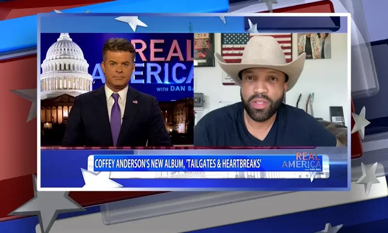Video still from Real America on One America News Network showing a split screen of the host on the left side, and on the right side is the guest, Coffey Anderson.