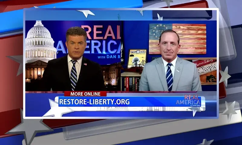 Video still from Real America on One America News Network showing a split screen of the host on the left side, and on the right side is the guest, Lt. Col. Darin Gaub.