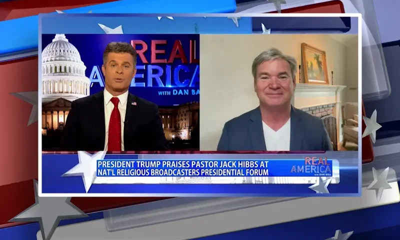 Video still from Real America on One America News Network showing a split screen of the host on the left side, and on the right side is the guest, Jack Hibbs.