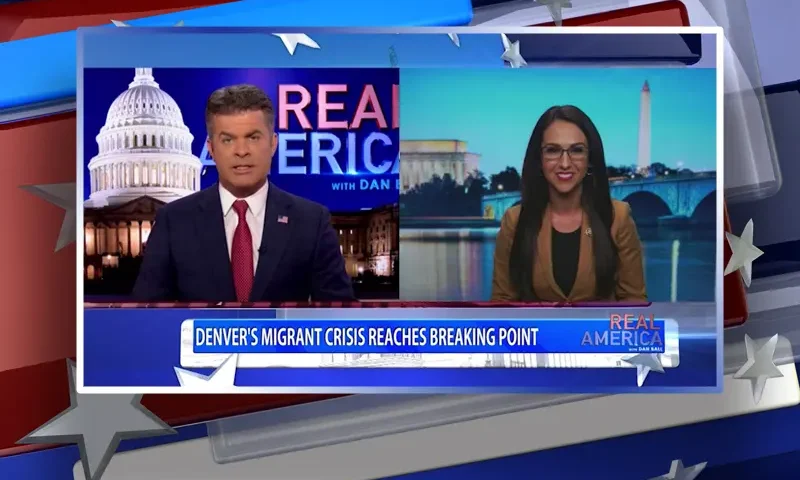 Video still from Real America on One America News Network showing a split screen of the host on the left side, and on the right side is the guest, Rep. Lauren Boebert.