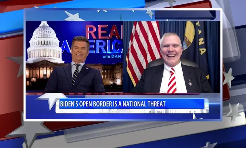 Video still from Real America on One America News Network showing a split screen of the host on the left side, and on the right side is the guest, Rep. Matt Rosendale.