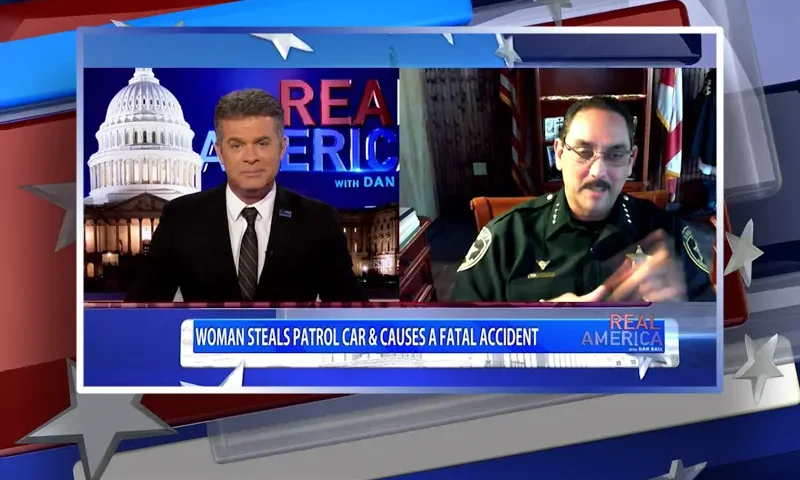 Video still from Real America on One America News Network showing a split screen of the host on the left side, and on the right side is the guest, Sheriff Billy Woods.