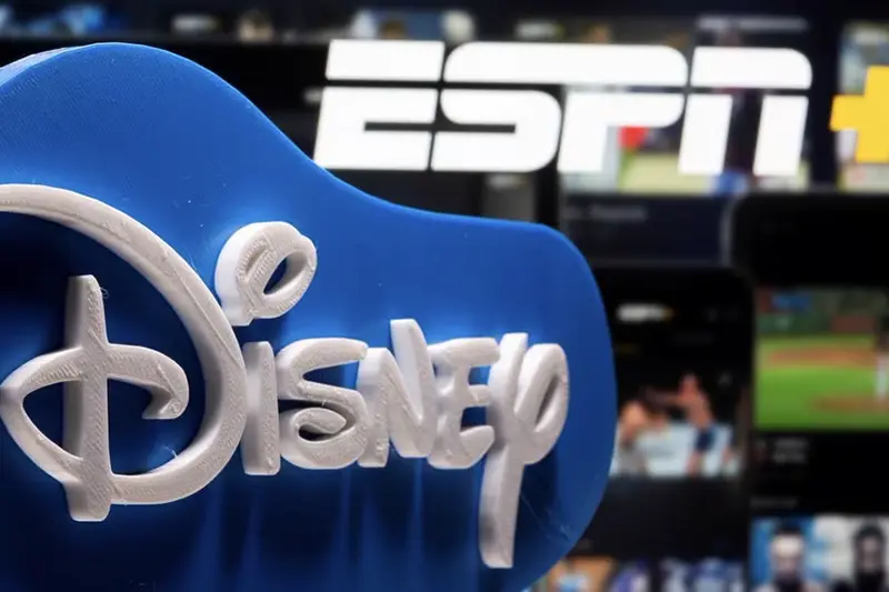 A 3D printed Disney logo is seen in front of the ESPN+ logo in this illustration taken on July 13, 2021. REUTERS/Dado Ruvic/Illustration/File Photo