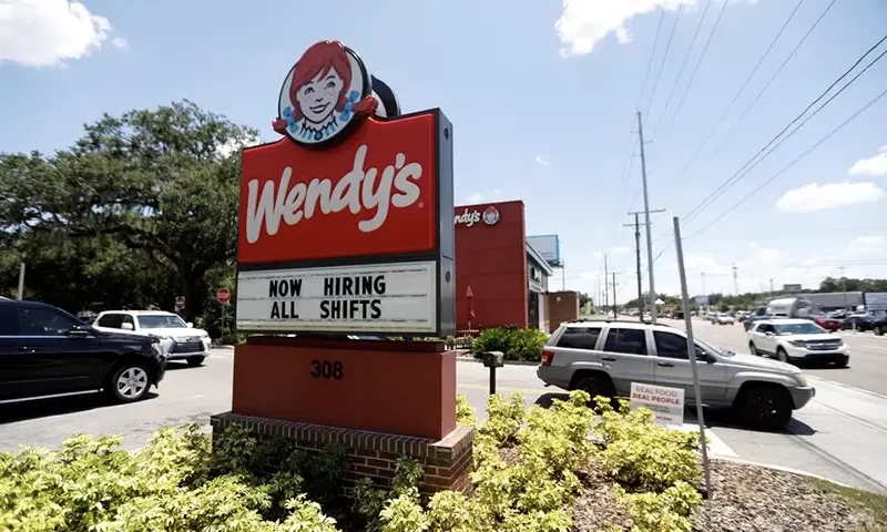 A Wendy?s restaurant displays a "Now Hiring" sign in Tampa, Florida, U.S., June 1, 2021. REUTERS/Octavio Jones/File Photo