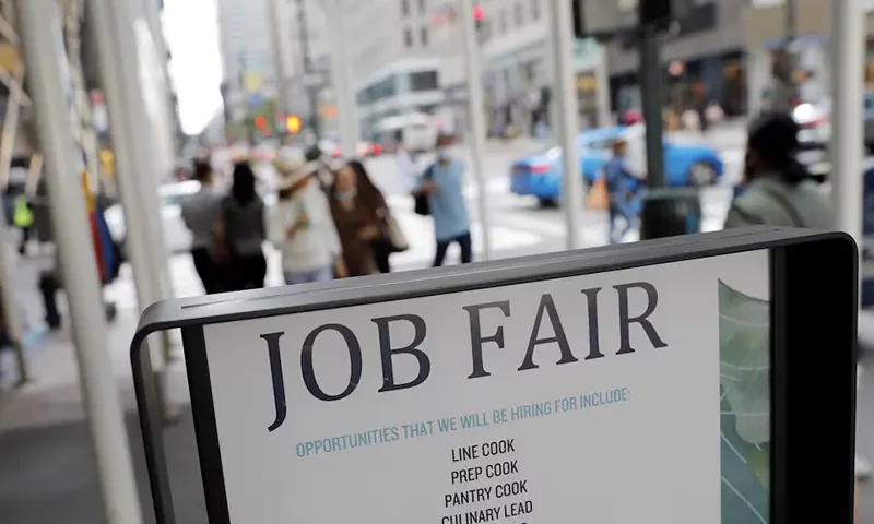 Signage for a job fair is seen on 5th Avenue after the release of the jobs report in Manhattan, New York City, U.S., September 3, 2021. REUTERS/Andrew Kelly/File Photo