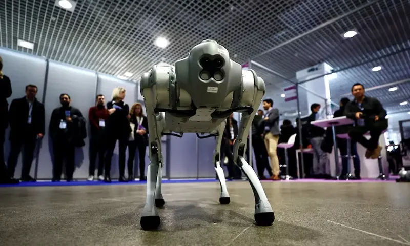 Visitors look at a Go1 quadruped robot by Unitree Robotics during the World Artificial Intelligence Cannes Festival (WAICF) in Cannes, France, February 10, 2023. REUTERS/Eric Gaillard/File photo