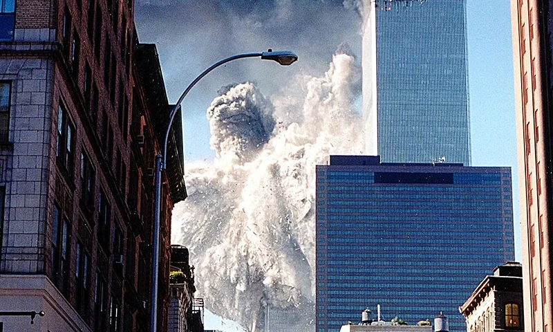 The south tower of the World Trade Center collapses sending dust and smoke into the streets 11 September, 2001, in New York. Two planes crashed into the towers which later collapsed. AFP PHOTO/Aaron MILESTONE (Photo credit should read AARON MILESTONE/AFP via Getty Images)