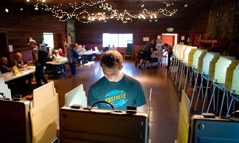 Voters fill out their ballots for the presidential primary in a log cabin run by the American Legion in San Anselmo, California, on Super Tuesday, March 3, 2020. Fourteen states and American Samoa are holding presidential primary elections, with over 1400 delegates at stake. (Photo by Josh Edelson / AFP) (Photo by JOSH EDELSON/AFP via Getty Images)