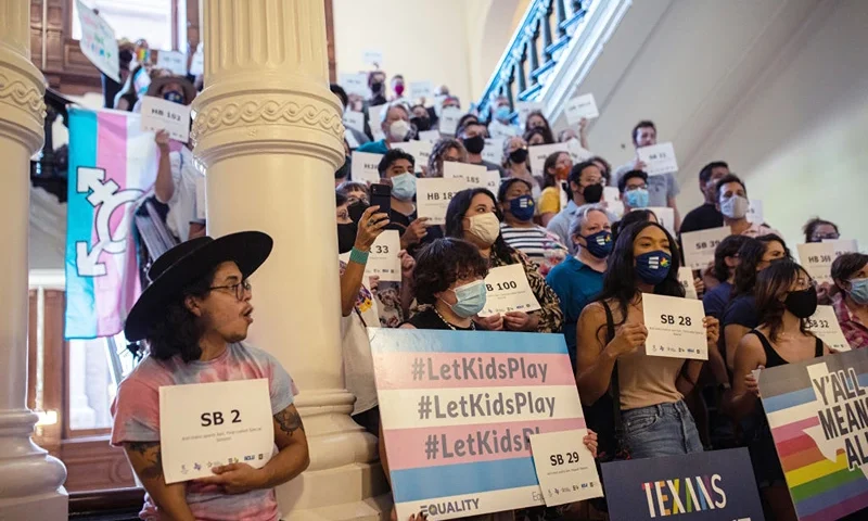 AUSTIN, TX - SEPTEMBER 20: LGBTQ rights supporters gather at the Texas State Capitol to protest state Republican-led efforts to pass legislation that would restrict the participation of transgender student athletes on the first day of the 87th Legislature's third special session on September 20, 2021 in Austin, Texas. Following a second special session that saw the passage of controversial voting and abortion laws, Texas lawmakers have convened at the Capitol for a third special session to address more of Republican Gov. Greg Abbott's conservative priorities which include redistricting, the distribution of federal COVID-19 relief funds, vaccine mandates and restrictions on how transgender student athletes can compete in sports. (Photo by Tamir Kalifa/Getty Images)