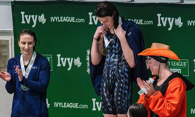 Penn Universitys transgender swimmer Lia Thomas holds her medal during a award presentation after taking first place in the 500 yard freestyle race with a time of 4.37.32 during the championship final race in heat three during the Women's Ivy League Swimming & Diving Championships at Harvard University in Cambridge, Massachusetts on February 17, 2022. (Photo by Joseph Prezioso / AFP) (Photo by JOSEPH PREZIOSO/AFP via Getty Images)
