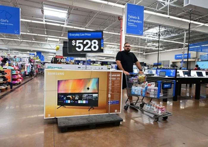 A man pushes his cart through a store in Rosemead, California on June 28, 2022. - Americans' feelings about the economy slumped further in June after falling sharply the month before amid concerns over skyrocketing inflation, according to a survey released on June 28. Amid the fastest increase in US consumer prices in more than four decades, made worse by the war in Ukraine, the consumer confidence index fell to 98.7 from 103.2, its lowest level since February 2021, according to The Conference Board's monthly survey. (Photo by Frederic J. BROWN / AFP) (Photo by FREDERIC J. BROWN/AFP via Getty Images)