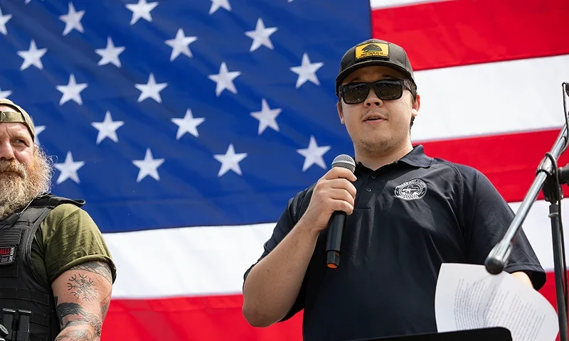 IONIA, MICHIGAN - JULY 19: Kyle Rittenhouse (right), the then-17-year-old who, in 2020, shot and killed two protestors in Kenosha, Wisconsin, claimed self-defense, and was found not guilty, speaks to supporters of the 2nd Amendment at a "Defend Our 2A: Michigan's Fight for Self Preservation" rally at a farm on July 19, 2023 in Ionia, Michigan. The rally was moved this year from the Michigan State Capitol where it was previously held. Other speakers at the rally are former Arizona Sheriff Richard Mack, and Mark and Patricia McCloskey. (Photo by Bill Pugliano/Getty Images)