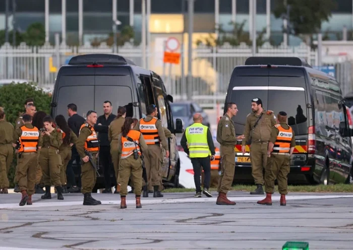 Israeli security forces stand next to buses waiting at the helipad of Tel Aviv's Schneider medical centre on November 24, 2023, amid preparations for the release of Israeli hostages held by Hamas in Gaza in exchange for Palestinian prisoners later in the day. After 48 days of gunfire and bombardment that claimed thousands of lives, a four-day truce in the Israel-Hamas war began on November 24 with 50 hostages set to be released in exchange for 150 Palestinian prisoners. (Photo by Jack GUEZ / AFP) / "The erroneous mention[s] appearing in the metadata of this phot has been modified in AFP systems in the following manner: [by Jack Guez] instead of [by Fadel Senna]. Please immediately remove the erroneous mention[s] from all your online services and delete it (them) from your servers. If you have been authorized by AFP to distribute it (them) to third parties, please ensure that the same actions are carried out by them. Failure to promptly comply with these instructions will entail liability on your part for any continued or post notification usage. Therefore we thank you very much for all your attention and prompt action. We are sorry for the inconvenience this notification may cause and remain at your disposal for any further information you may require." (Photo by JACK GUEZ/AFP via Getty Images)