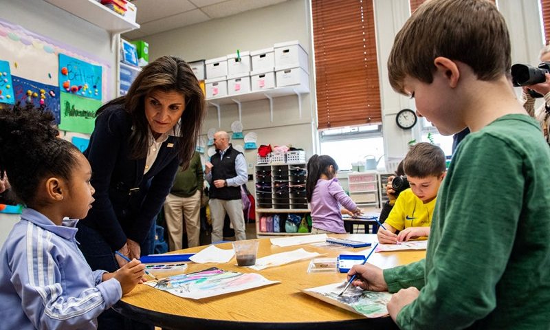 Former UN ambassador and 2024 presidential hopeful Nikki Haley speaks with children in a kindergarten/first grade classroom at the Polaris Charter School in Manchester, New Hampshire, on January 19, 2024. The state's primary is scheduled for January 23, 2024. (Photo by Joseph Prezioso / AFP) (Photo by JOSEPH PREZIOSO/AFP via Getty Images)