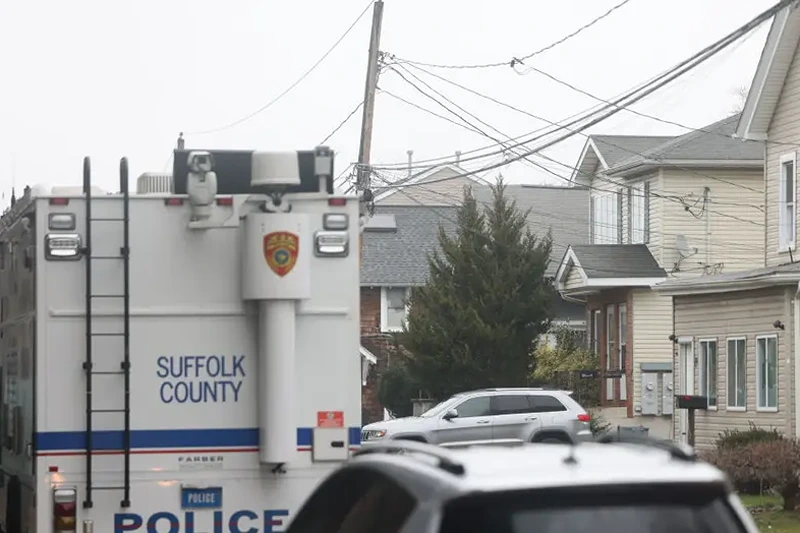 Suffolk County Police Crime Scene investigators outside of a home on Railroad Avenue in Amityville, New York on March 5, 2024, in connection to body parts that had been discovered at Southards Pond Park in Babylon, Bethpage State Park, and West Babylon. (Photo by James Carbone/Newsday RM via Getty Images)