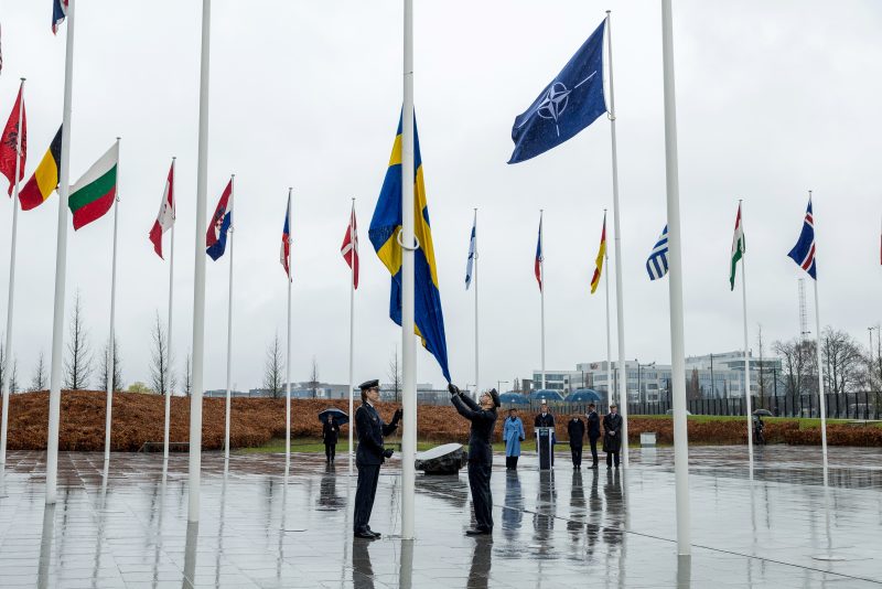 BRUSSELS, BELGIUM - MARCH 11: Military personnel raise the Swedish flag during Sweden's NATO accession ceremony at NATO headquarters in the presence of Sweden's Prime Minister Ulf Kristersson, NATO Secretary General Jens Stoltenberg and Sweden's Crown Princess Victoria during a flag-raising ceremony on March 11, 2024 in Brussels, Belgium. The ceremony was held to mark Sweden's accession to the military alliance, which was made official last week after the country shed its previously neutral stance. Sweden, like Finland, were spurred to join the alliance after Russia's invasion of Ukraine. (Photo by Omar Havana/Getty Images) (Photo by Omar Havana/Getty Images)