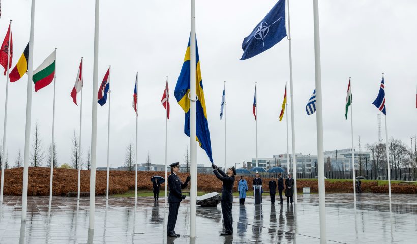 BRUSSELS, BELGIUM - MARCH 11: Military personnel raise the Swedish flag during Sweden's NATO accession ceremony at NATO headquarters in the presence of Sweden's Prime Minister Ulf Kristersson, NATO Secretary General Jens Stoltenberg and Sweden's Crown Princess Victoria during a flag-raising ceremony on March 11, 2024 in Brussels, Belgium. The ceremony was held to mark Sweden's accession to the military alliance, which was made official last week after the country shed its previously neutral stance. Sweden, like Finland, were spurred to join the alliance after Russia's invasion of Ukraine. (Photo by Omar Havana/Getty Images) (Photo by Omar Havana/Getty Images)