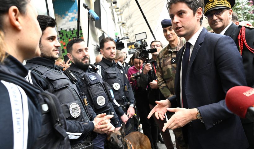 French Prime Minister Gabriel Attal (2nd R) speaks with French SNCF railway's security staff during a visit to the Saint-Lazare railway station in Paris on March 25, 2024. Four months ahead of the Paris 2024 Olympic Games, French authorities has raised the maximum alert level for terrorist threat, after the Moscow attack carried out, according to the French President, by an "entity" of the "Islamic State" group behind "several recent attempts" on French territory. (Photo by Bertrand GUAY / AFP) (Photo by BERTRAND GUAY/AFP via Getty Images)