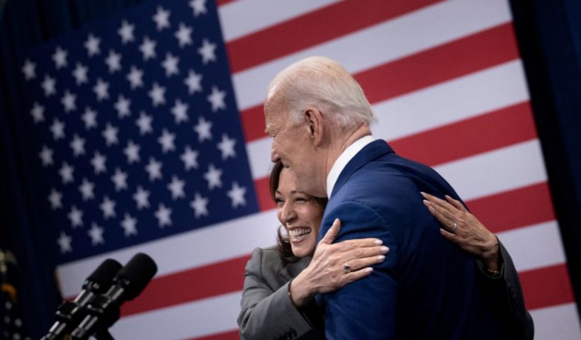 TOPSHOT - US President Joe Biden is hugged by US Vice President Kamala Harris after speaking about healthcare during an event at the John Chavis recreation center on March 26, 2024 in Raleigh, North Carolina. (Photo by Brendan Smialowski / AFP) (Photo by BRENDAN SMIALOWSKI/AFP via Getty Images)