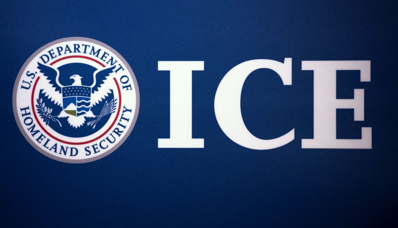 The Immigration and Customs Enforcement (ICE) seal is seen before a press conference discussing ongoing enforcement efforts to combat human smuggling along the Southwest border of the United States, July 22, 2014 at ICE headquarters in Washington, DC. AFP Photo/Paul J. Richards (Photo by Paul J. RICHARDS / AFP) (Photo by PAUL J. RICHARDS/AFP via Getty Images)