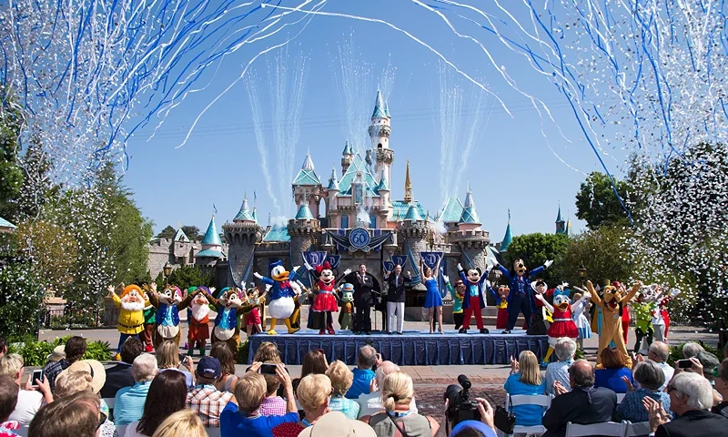Disneyland Turns 60 ANAHEIM, CA - JULY 17: In this handout photo provided by Disney parks, Mickey Mouse and his friends celebrate the 60th anniversary of Disneyland park during a ceremony at Sleeping Beauty Castle featuring Academy Award-winning composer, Richard Sherman and Broadway actress and singer Ashley Brown July 17, 2015 in Anaheim, California. Celebrating six decades of magic, the Disneyland Resort Diamond Celebration features three new nighttime spectaculars that immerse guests in the worlds of Disney stories like never before with "Paint the Night," the first all-LED parade at the resort; "Disneyland Forever," a reinvention of classic fireworks that adds projections to pyrotechnics to transform the park experience; and a moving new version of "World of Color" that celebrates Walt Disneys dream for Disneyland. (Photo by Paul Hiffmeyer/Disneyland Resort via Getty Images)