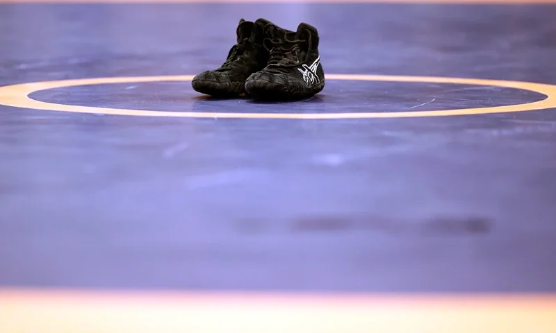2016 U.S. Olympic Team Wrestling Trials - Day 1 IOWA CITY, IOWA - APRIL 09: Spenser Mango's shoes are seen on the mat in retirement after losing his Greco-Roman 59kg semifinal match to Jesse Thielke during day 1 of the Olympic Team Wrestling Trials at Carver-Hawkeye Arena on April 9, 2016 in Iowa City, Iowa. (Photo by Jamie Squire/Getty Images)