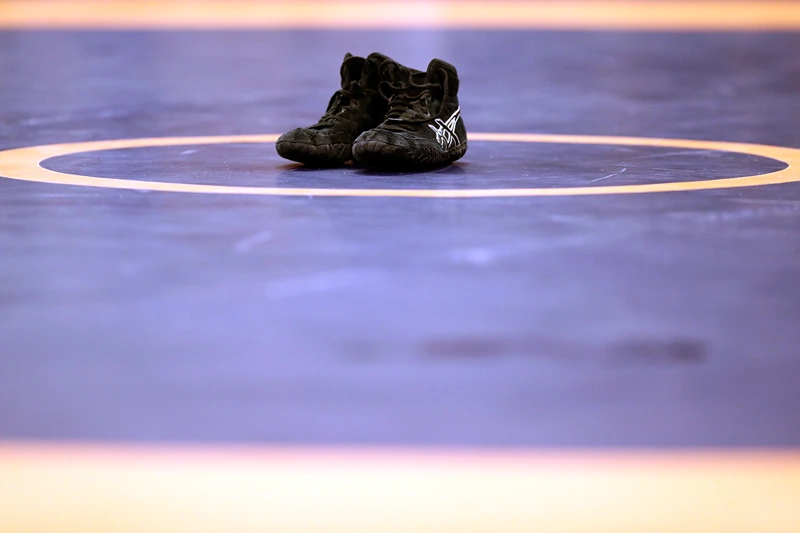 2016 U.S. Olympic Team Wrestling Trials - Day 1
IOWA CITY, IOWA - APRIL 09: Spenser Mango's shoes are seen on the mat in retirement after losing his Greco-Roman 59kg semifinal match to Jesse Thielke during day 1 of the Olympic Team Wrestling Trials at Carver-Hawkeye Arena on April 9, 2016 in Iowa City, Iowa. (Photo by Jamie Squire/Getty Images)