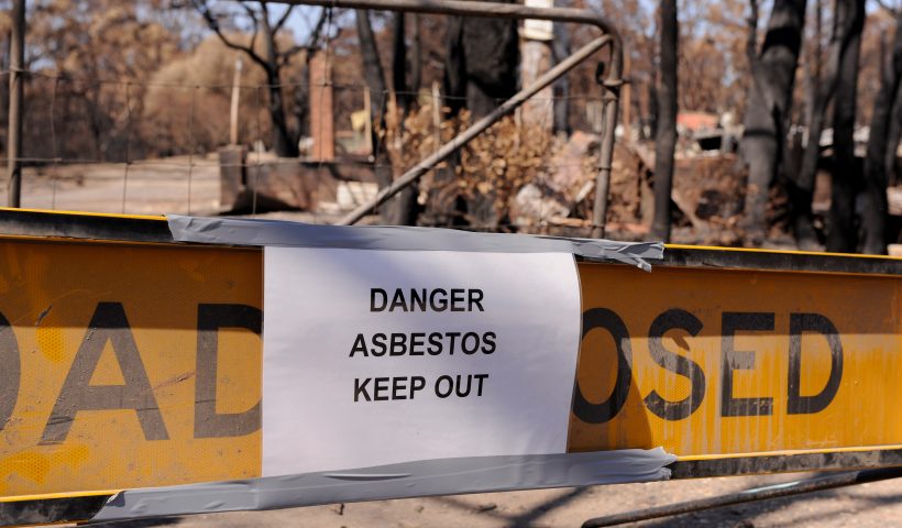 WONDONG, AUSTRALIA - FEBRUARY 19: A sign warns of the dangers of asbestos at a burnt out property in the Wondong region on February 19, 2009 in Wondong, Australia. Victoria Police have revised the bushfire disaster death toll to over 200, the worst in Australia's history. (Photo by Robert Cianflone/Getty Images)