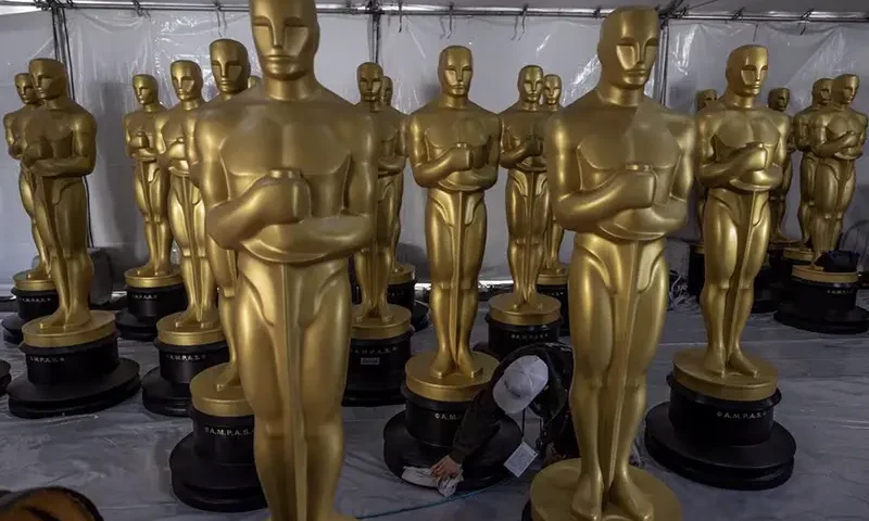 Oscar statues sit before being placed out for display as preparations continue for the 96th Academy Awards Awards in Los Angeles, California U.S., March 6, 2024. REUTERS/Carlos Barria/File Photo
