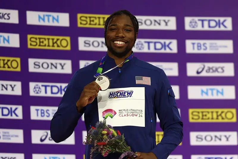 Silver medallist Noah Lyles of the U.S. poses on the podium during the medal ceremony for the men's 60m REUTERS/Hannah Mckay/File Photo