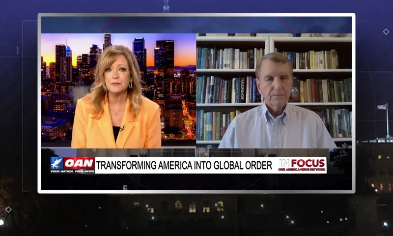 Video still from In Focus on One America News Network showing a split screen of the host on the left side, and on the right side is the guest, Scott Powell.