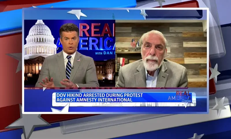 Video still from Real America on One America News Network showing a split screen of the host on the left side, and on the right side is the guest, Dov Hikind.