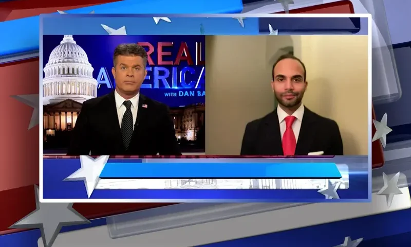Video still from Real America on One America News Network showing a split screen of the host on the left side, and on the right side is the guest, George Papadopoulos.