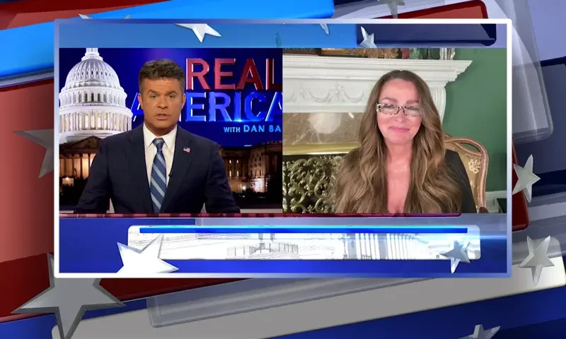 Video still from Real America on One America News Network showing a split screen of the host on the left side, and on the right side is the guest, Charlene Bollinger.
