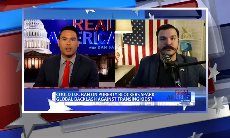 Video still from Real America on One America News Network showing a split screen of the host on the left side, and on the right side is the guest, Anthony Cabassa.