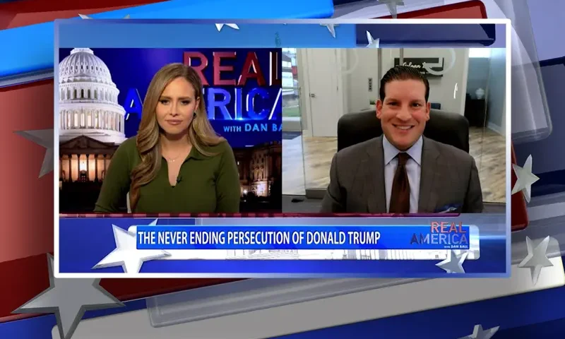 Video still from Real America on One America News Network showing a split screen of the host on the left side, and on the right side is the guest, David Gelman.