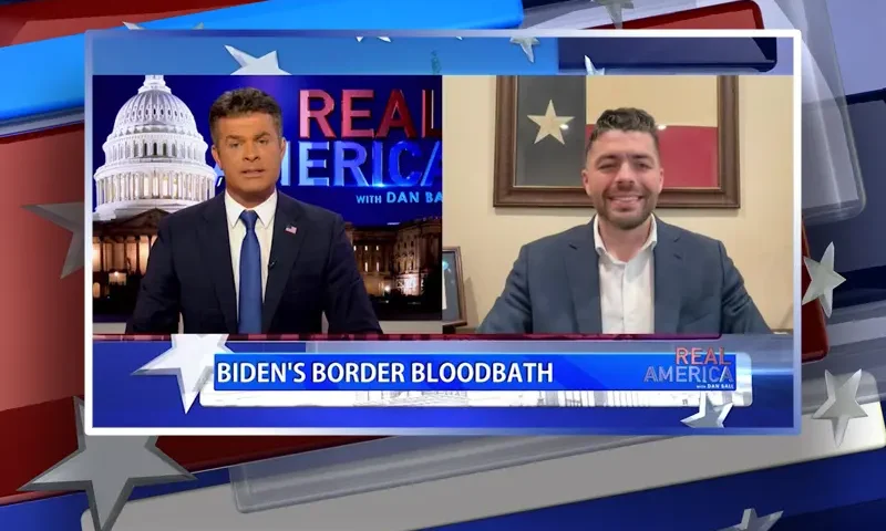 Video still from Real America on One America News Network showing a split screen of the host on the left side, and on the right side is the guest, Rep. Nate Schatzline.