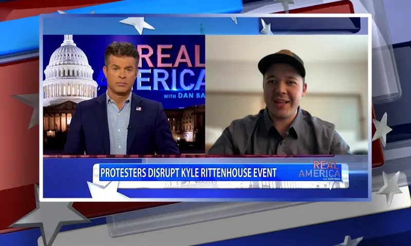 Video still from Real America on One America News Network showing a split screen of the host on the left side, and on the right side is the guest, Kyle Rittenhouse.