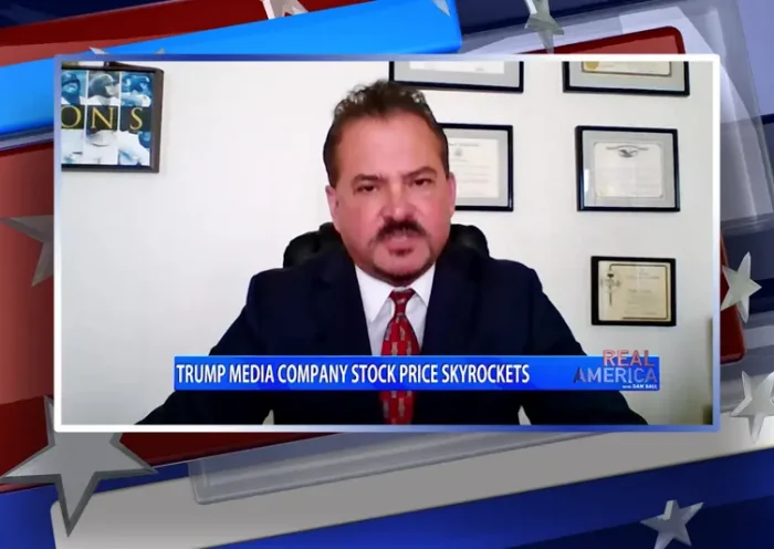 Video still from Real America on One America News Network during an interview with the guest, David Wohl.