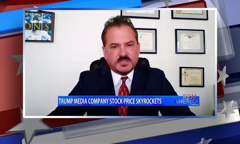 Video still from Real America on One America News Network during an interview with the guest, David Wohl.