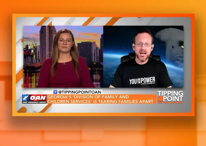 Video still from Tipping Point on One America News Network showing a split screen of the host on the left side, and on the right side is the guest, Spike Cohen.