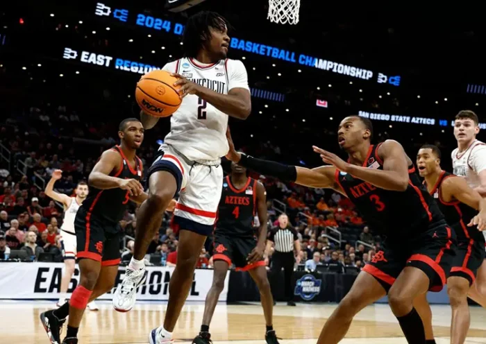 Connecticut Huskies guard Tristen Newton (2) makes a pass against the San Diego State Aztecs in the semifinals of the East Regional of the 2024 NCAA Tournament at TD Garden. Mandatory Credit: Winslow Townson-USA TODAY Sports