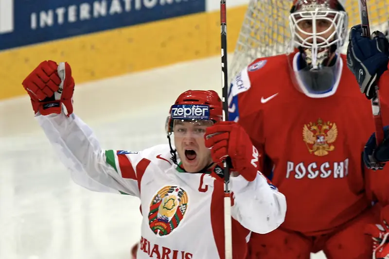 Belarus' Konstantin Koltsov (L) celebrates a goal against Russia during their IIHF World Hockey Championship quarterfinal game in Bern May 6, 2009. REUTERS/Michael Buholzer/File Photo