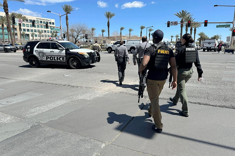 Law enforcement responds to a shooting Monday, April 8, 2024 at a law office in Las Vegas. (AP Photo/Ty ONeil)