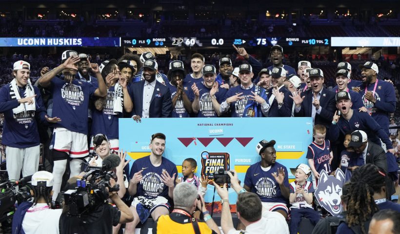 UConn poses after their win against Purdue in the NCAA college Final Four championship basketball game, Monday, April 8, 2024, in Glendale, Ariz. (AP Photo/David J. Phillip)