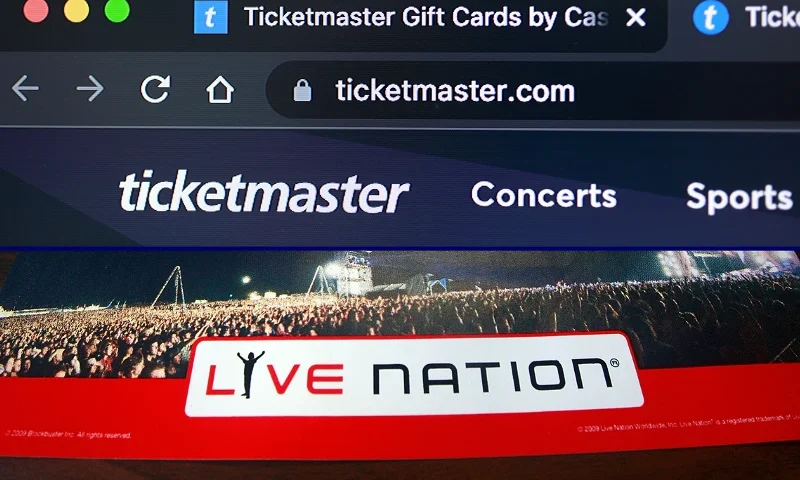(Top) MIAMI, FLORIDA - NOVEMBER 18: : In this photo illustration, A ticketmaster website is shown on a computer screen on November 18, 2022 in Miami, Florida. The Justice Department is reportedly investigating the parent company of Ticketmaster for possible antitrust violations, this follows the news that Taylor Swift concert ticket sales overwhelmed the Ticketmaster system.(Photo illustration by Joe Raedle/Getty Images) / (Bottom) NEW YORK - FEBRUARY 11: A Live Nation sign is seen inside a Blockbuster store February 11, 2009 in New York City. Music corporations Live Nation and Ticketmaster Entertainment announced merger plans raising anti-trust concerns. (Photo by Mario Tama/Getty Images)