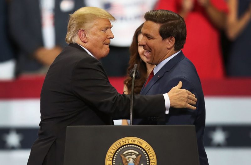 ESTERO, FL - OCTOBER 31: President Donald Trump greets Florida Republican gubernatorial candidate Ron DeSantis during a campaign rally at the Hertz Arena on October 31, 2018 in Estero, Florida. President Trump continues traveling across America to help get the vote out for Republican candidates running for office. (Photo by Joe Raedle/Getty Images)